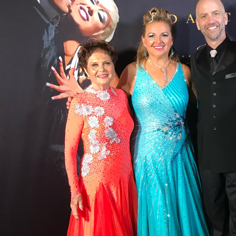 Custom designed teal Swarovski ballroom competition gown